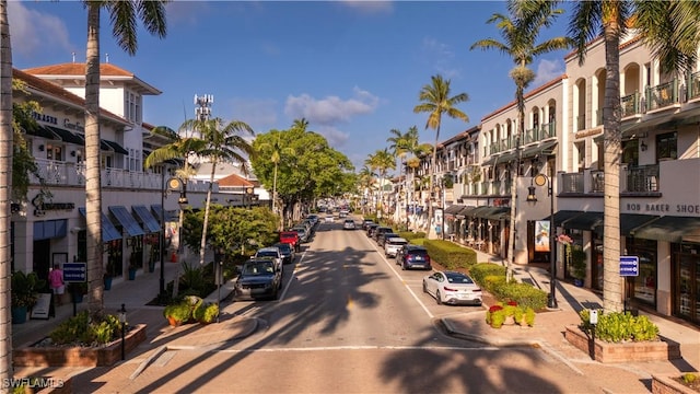 view of street featuring street lighting, curbs, and sidewalks