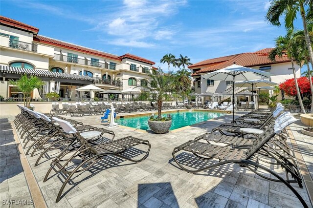 221 9th St S Unit 219, Naples, FL 34102 - pool featuring a patio area