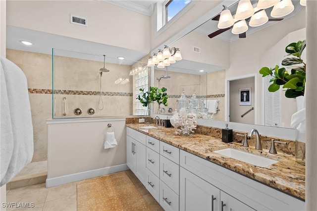 11476 Quail Village Way, Naples, FL 34119 - full bath featuring double vanity, ornamental molding, a walk in shower, a ceiling fan, and tile patterned flooring
