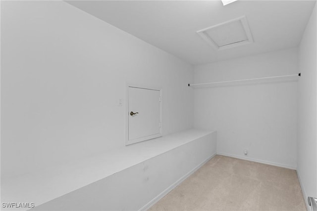 11476 Quail Village Way, Naples, FL 34119 - spacious closet featuring light colored carpet, attic access, and baseboard heating