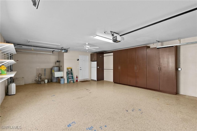 11476 Quail Village Way, Naples, FL 34119 - garage with freestanding refrigerator and a garage door opener