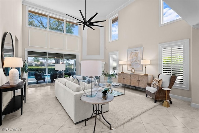 11476 Quail Village Way, Naples, FL 34119 - tiled living area featuring a high ceiling, ceiling fan, plenty of natural light, and ornamental molding