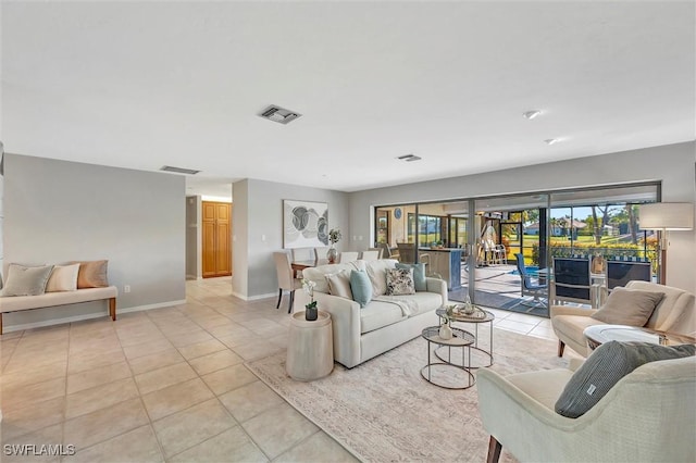 28389 Verde Ln, Bonita Springs, FL 34135 - living area featuring light tile patterned floors and baseboards