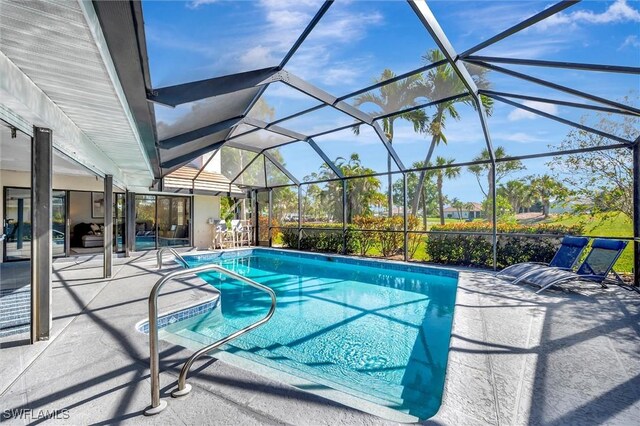 28389 Verde Ln, Bonita Springs, FL 34135 - swimming pool featuring a patio and glass enclosure