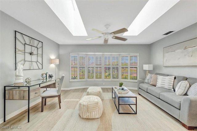 28389 Verde Ln, Bonita Springs, FL 34135 - living room with a skylight, wood finished floors, and baseboards