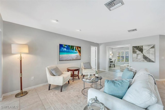 28389 Verde Ln, Bonita Springs, FL 34135 - living room featuring light tile patterned flooring and baseboards