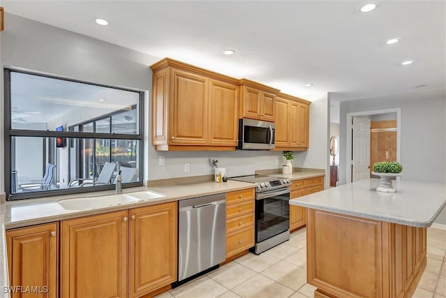 28389 Verde Ln, Bonita Springs, FL 34135 - kitchen with stainless steel appliances, a sink, light countertops, a center island, and recessed lighting