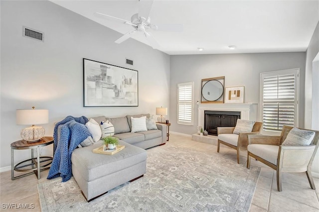 28389 Verde Ln, Bonita Springs, FL 34135 - living area with lofted ceiling, light tile patterned floors, baseboards, and ceiling fan
