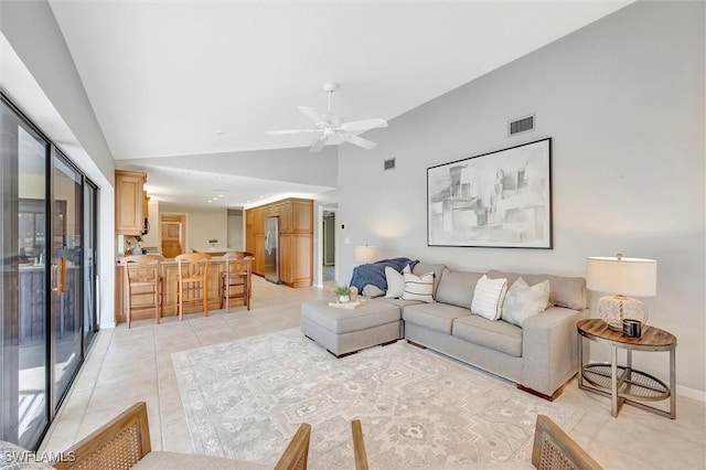 28389 Verde Ln, Bonita Springs, FL 34135 - living room featuring lofted ceiling, light tile patterned floors, a ceiling fan, and baseboards