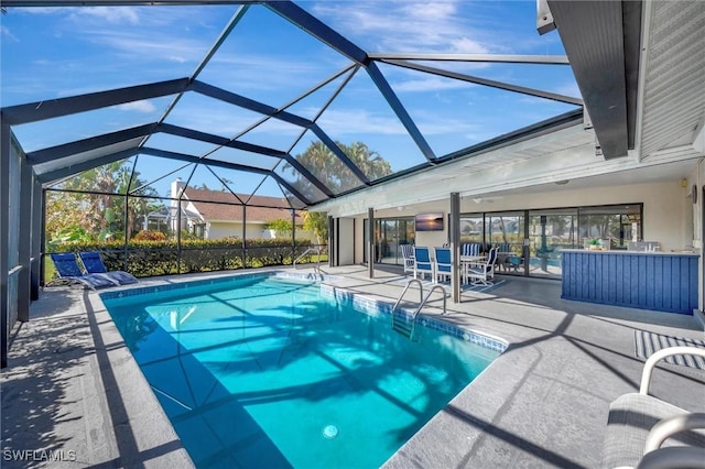 28389 Verde Ln, Bonita Springs, FL 34135 - outdoor pool featuring a patio area and glass enclosure