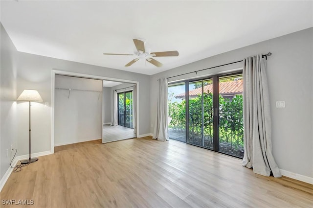28389 Verde Ln, Bonita Springs, FL 34135 - unfurnished bedroom featuring light wood-type flooring, baseboards, and a closet