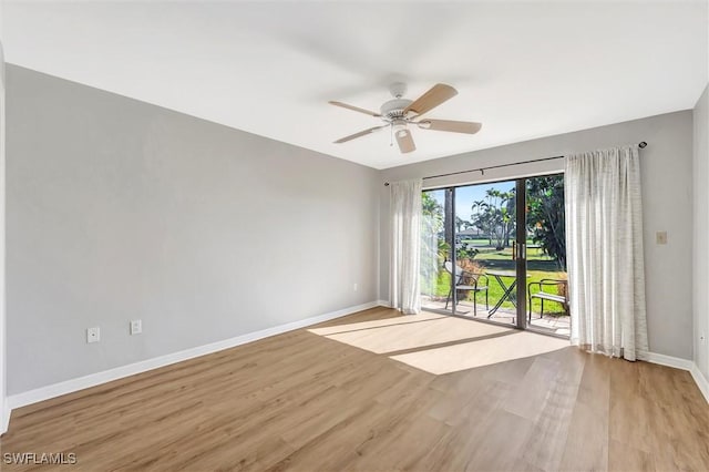 28389 Verde Ln, Bonita Springs, FL 34135 - empty room with baseboards, light wood finished floors, and ceiling fan