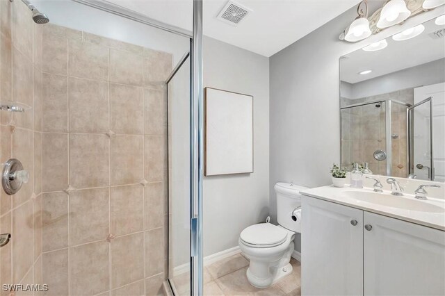28389 Verde Ln, Bonita Springs, FL 34135 - bathroom featuring a stall shower, toilet, vanity, and tile patterned flooring