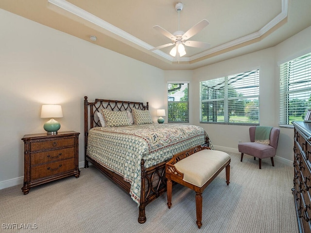 7826 Martino Cir, Naples, FL 34112 - bedroom with baseboards, light carpet, multiple windows, and a raised ceiling