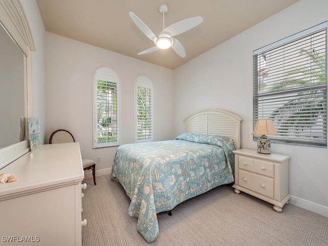 7826 Martino Cir, Naples, FL 34112 - bedroom featuring baseboards, ceiling fan, and light carpet
