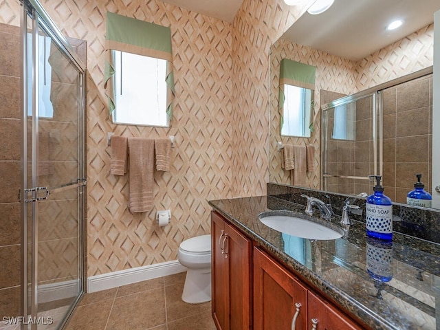 7826 Martino Cir, Naples, FL 34112 - full bathroom featuring tile patterned flooring, vanity, toilet, baseboards, and a stall shower