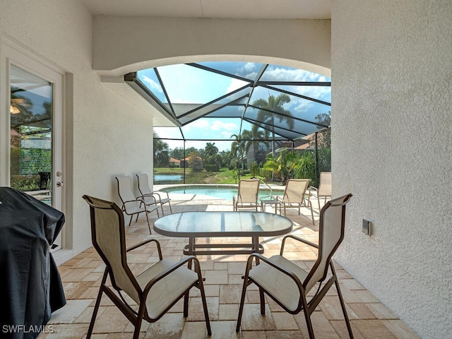 7826 Martino Cir, Naples, FL 34112 - view of patio / terrace featuring glass enclosure, a grill, and an outdoor pool