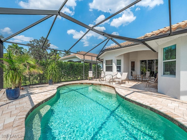 7826 Martino Cir, Naples, FL 34112 - pool with glass enclosure and a patio