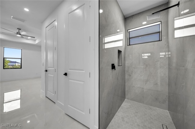 129 NE 5th Ter, Cape Coral, FL 33909 - full bath featuring visible vents, a ceiling fan, and a marble finish shower