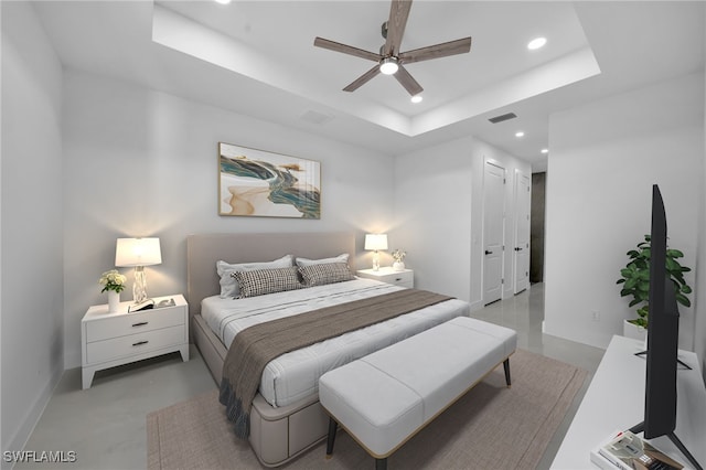129 NE 5th Ter, Cape Coral, FL 33909 - bedroom featuring visible vents, baseboards, recessed lighting, finished concrete floors, and a tray ceiling