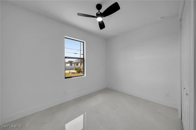 129 NE 5th Ter, Cape Coral, FL 33909 - empty room featuring baseboards and a ceiling fan