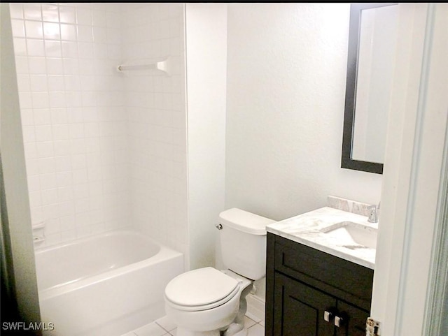 full bathroom featuring baseboards, bathtub / shower combination, toilet, tile patterned floors, and vanity