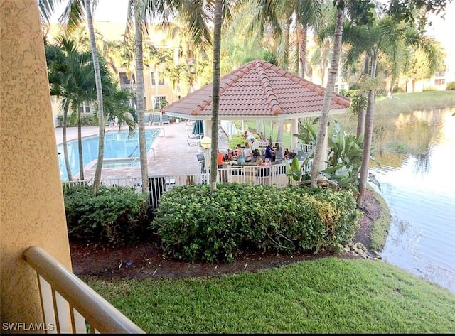 view of swimming pool featuring a gazebo and a water view