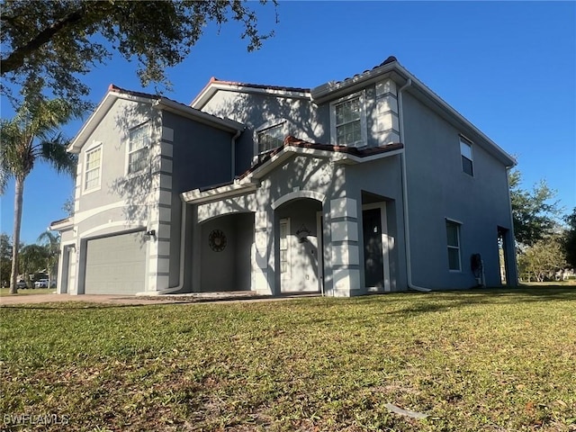 traditional-style home featuring stucco siding, an attached garage, and a front lawn
