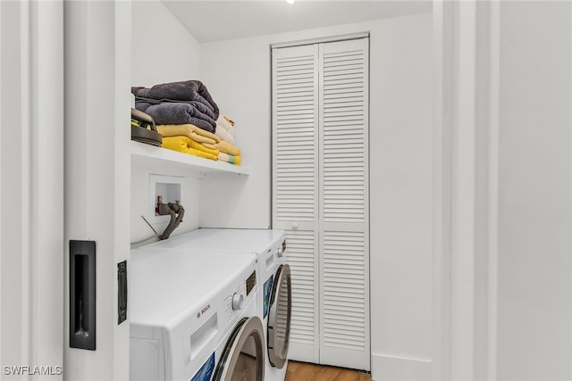 2401 Gulf Shore Blvd N Unit 13, Naples, FL 34103 - washroom featuring washer and clothes dryer and light wood-style floors