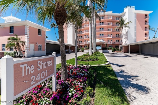 2401 Gulf Shore Blvd N Unit 13, Naples, FL 34103 - view of apartment building / complex featuring covered parking