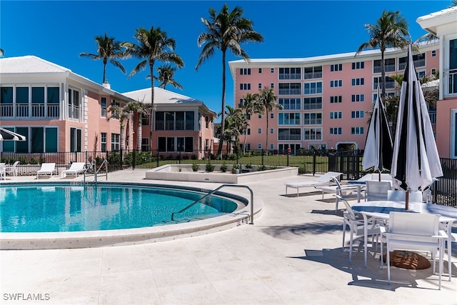 2401 Gulf Shore Blvd N Unit 13, Naples, FL 34103 - community pool featuring fence and a patio area