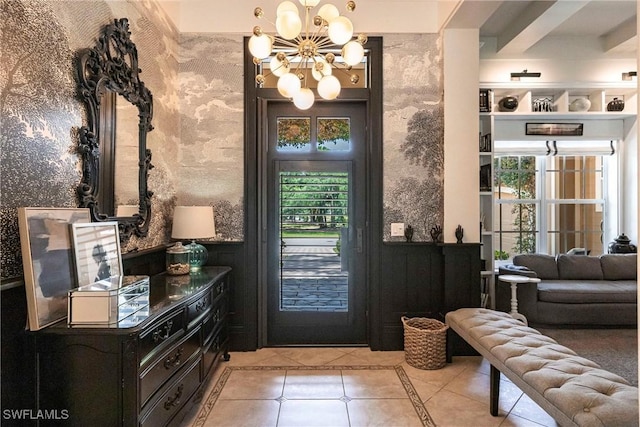doorway with light tile patterned floors and a notable chandelier