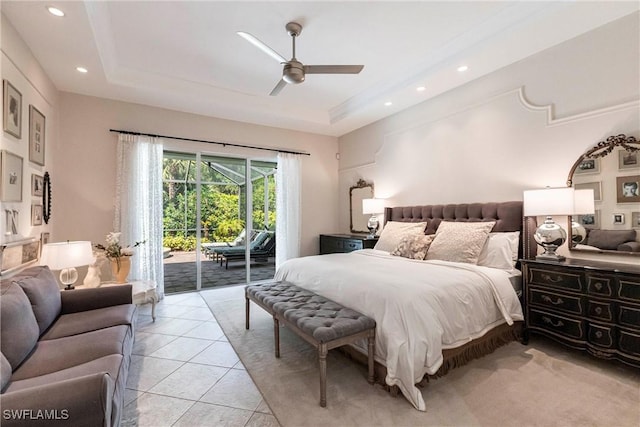 bedroom with a tray ceiling, access to outside, recessed lighting, and light tile patterned floors