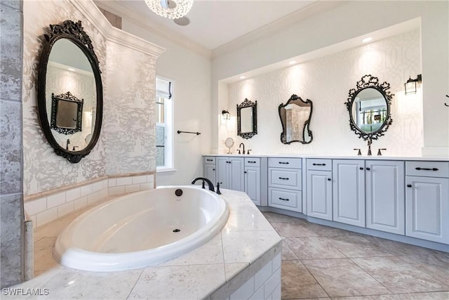 bathroom featuring ornamental molding, a sink, a garden tub, and wallpapered walls
