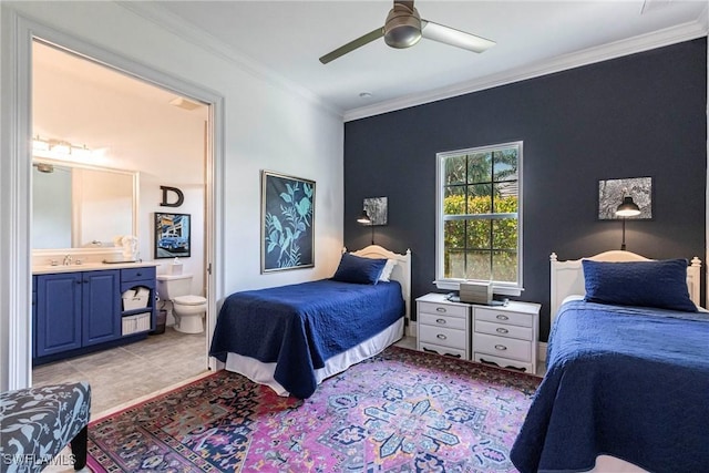 bedroom with a sink, ornamental molding, connected bathroom, and ceiling fan