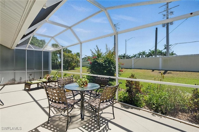 6103 Thresher Dr Unit 102, Naples, FL 34112 - view of patio / terrace with outdoor dining area and glass enclosure