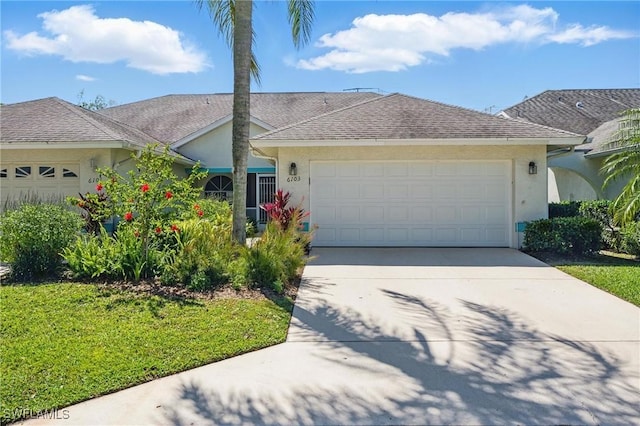 6103 Thresher Dr Unit 102, Naples, FL 34112 - single story home featuring stucco siding, driveway, a garage, and a front lawn