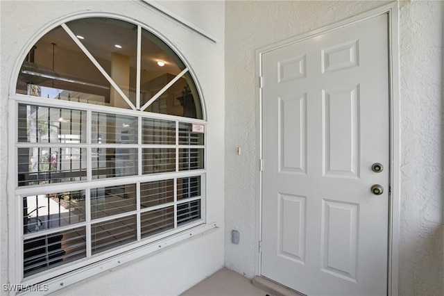 6103 Thresher Dr Unit 102, Naples, FL 34112 - view of exterior entry featuring stucco siding