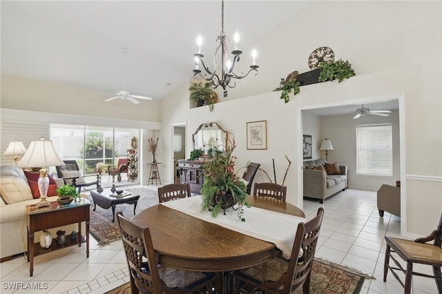 6103 Thresher Dr Unit 102, Naples, FL 34112 - dining area with a ceiling fan, light tile patterned floors, high vaulted ceiling, healthy amount of natural light, and a chandelier