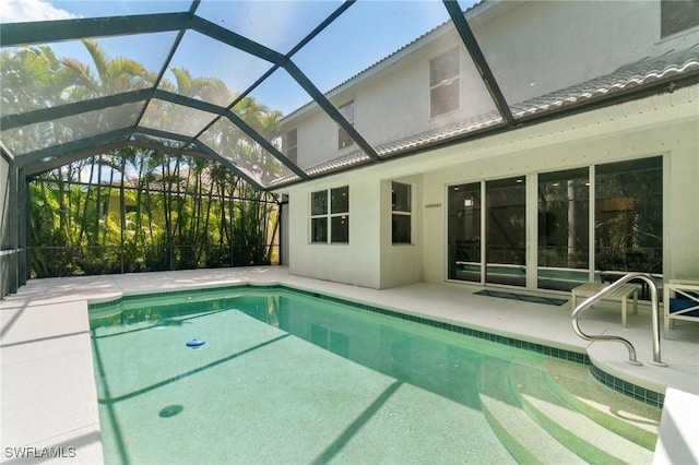 pool with a lanai and a patio area