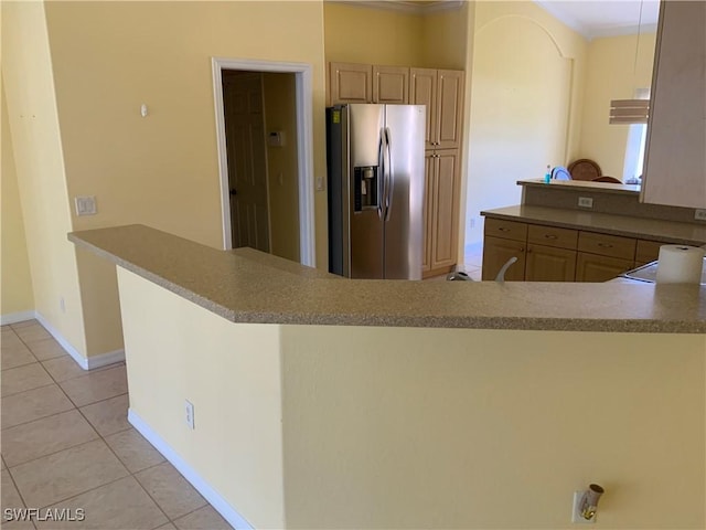 3817 NW 46th St, Cape Coral, FL 33993 - kitchen featuring stainless steel fridge with ice dispenser, light tile patterned floors, crown molding, a peninsula, and baseboards