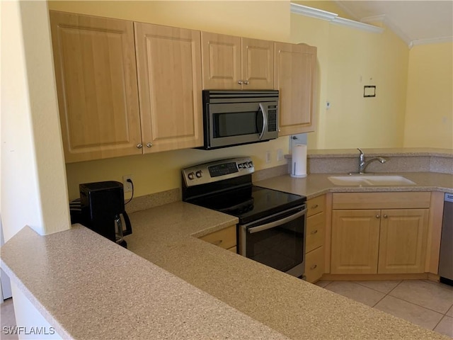 3817 NW 46th St, Cape Coral, FL 33993 - kitchen with stainless steel appliances, a sink, light brown cabinetry, crown molding, and a peninsula