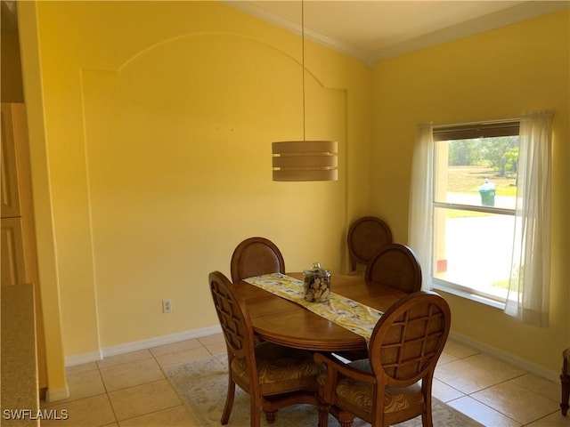 3817 NW 46th St, Cape Coral, FL 33993 - dining space featuring light tile patterned floors, ornamental molding, and baseboards