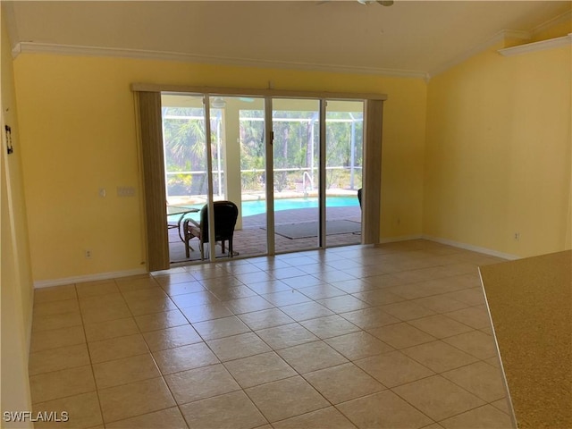 3817 NW 46th St, Cape Coral, FL 33993 - empty room featuring crown molding, light tile patterned floors, plenty of natural light, and baseboards