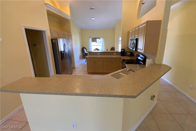 3817 NW 46th St, Cape Coral, FL 33993 - kitchen with appliances with stainless steel finishes, a peninsula, light tile patterned floors, and a sink