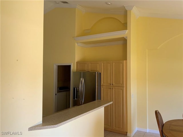 3817 NW 46th St, Cape Coral, FL 33993 - kitchen featuring stainless steel fridge, ornamental molding, light countertops, baseboards, and light tile patterned flooring