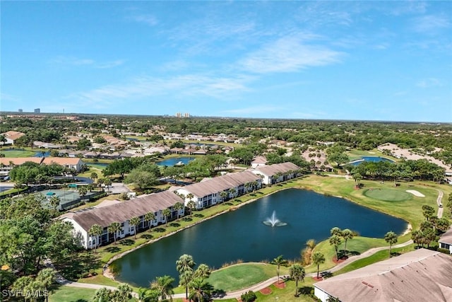drone / aerial view featuring a water view, golf course view, and a residential view