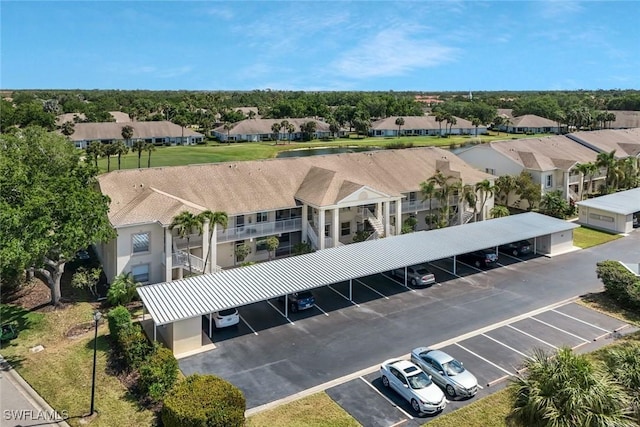 birds eye view of property with a residential view