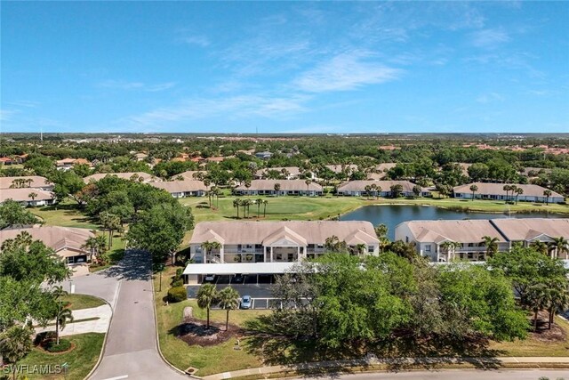 birds eye view of property featuring a water view and a residential view
