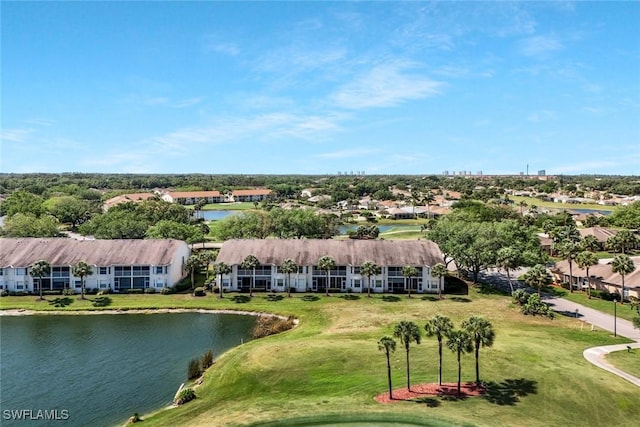drone / aerial view with a water view, golf course view, and a residential view